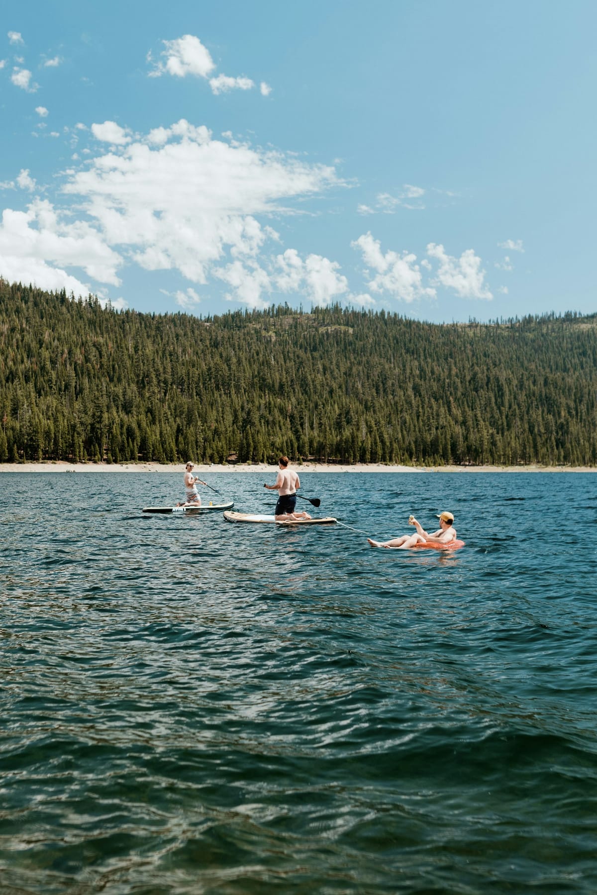 A swimmer diving into the lake