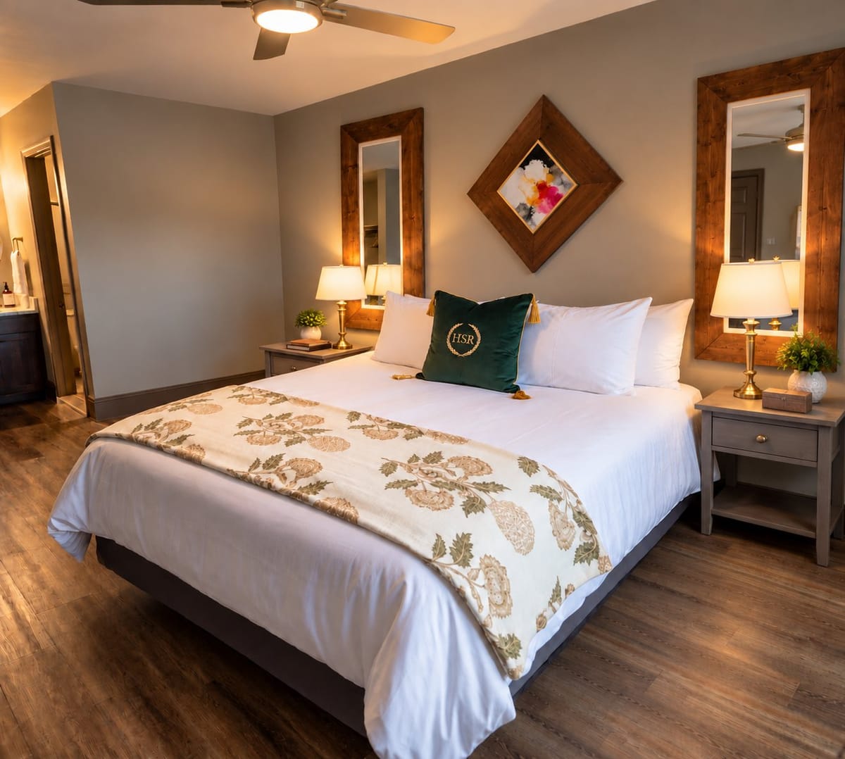 King room with a king bed and wood-framed mirrors