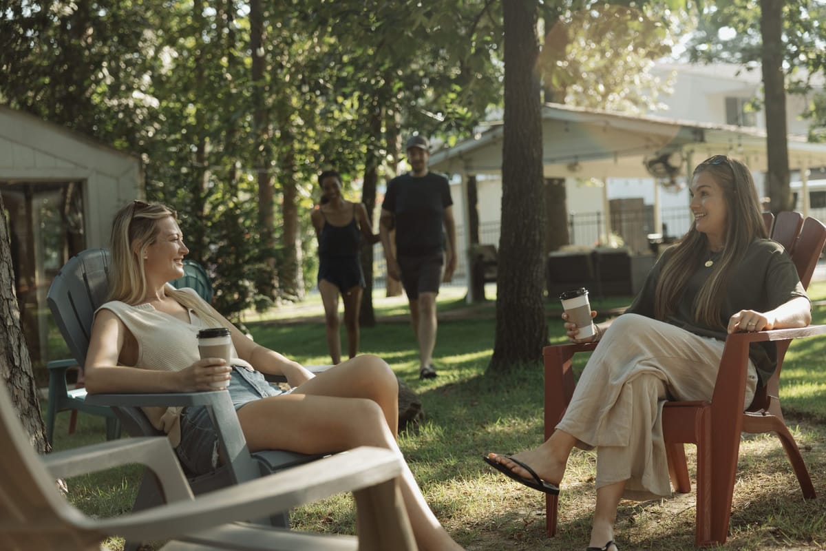 Friends relaxing together on the lawn