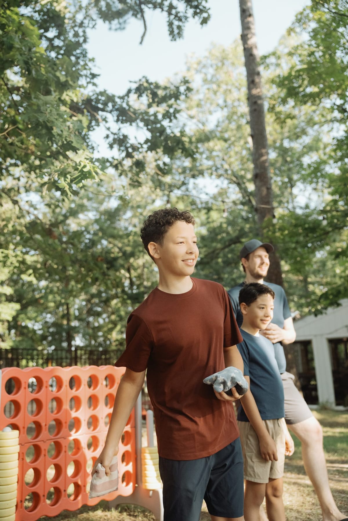 Kids playing giant Connect 4 on the lawn