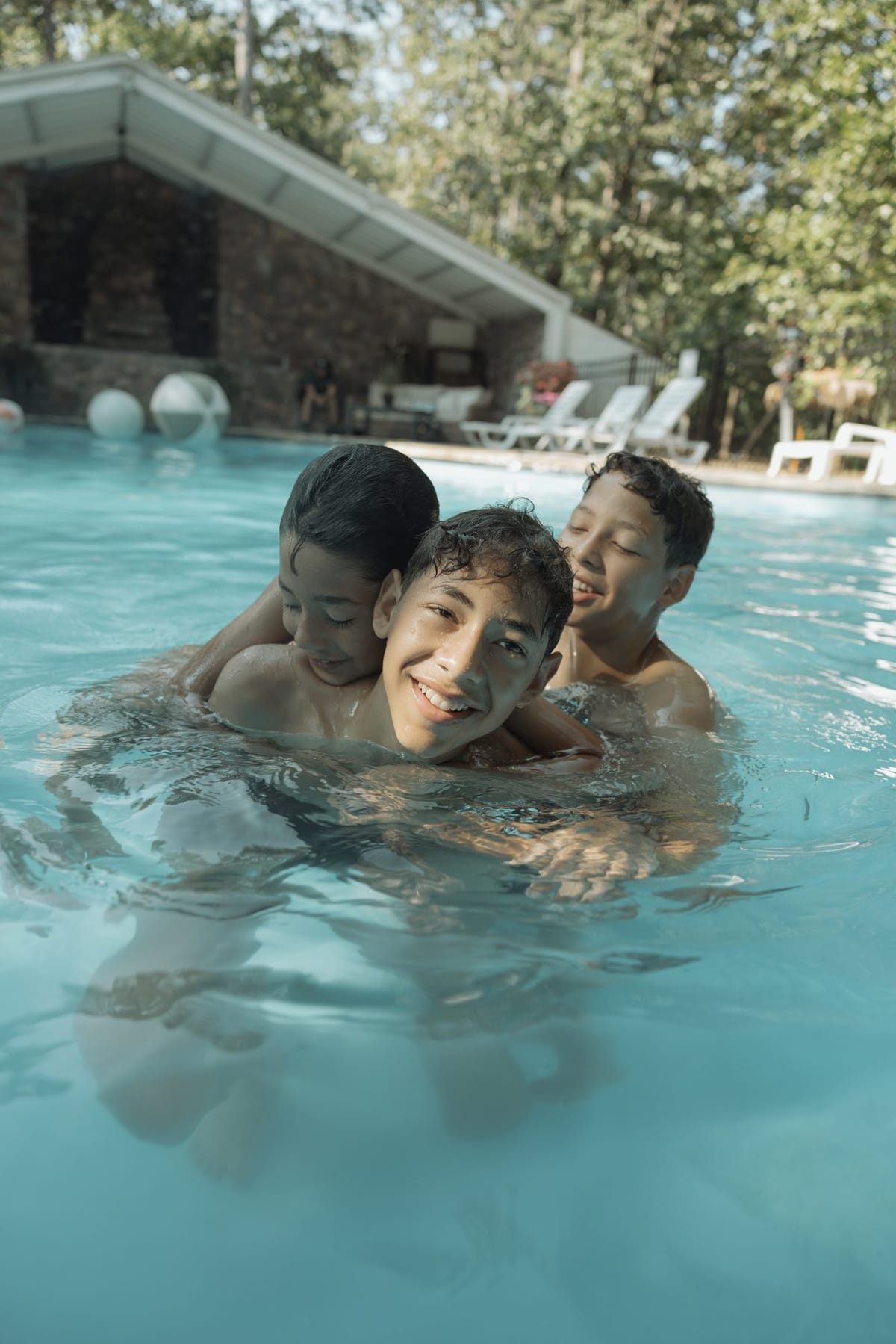 A family playing in the resort pool