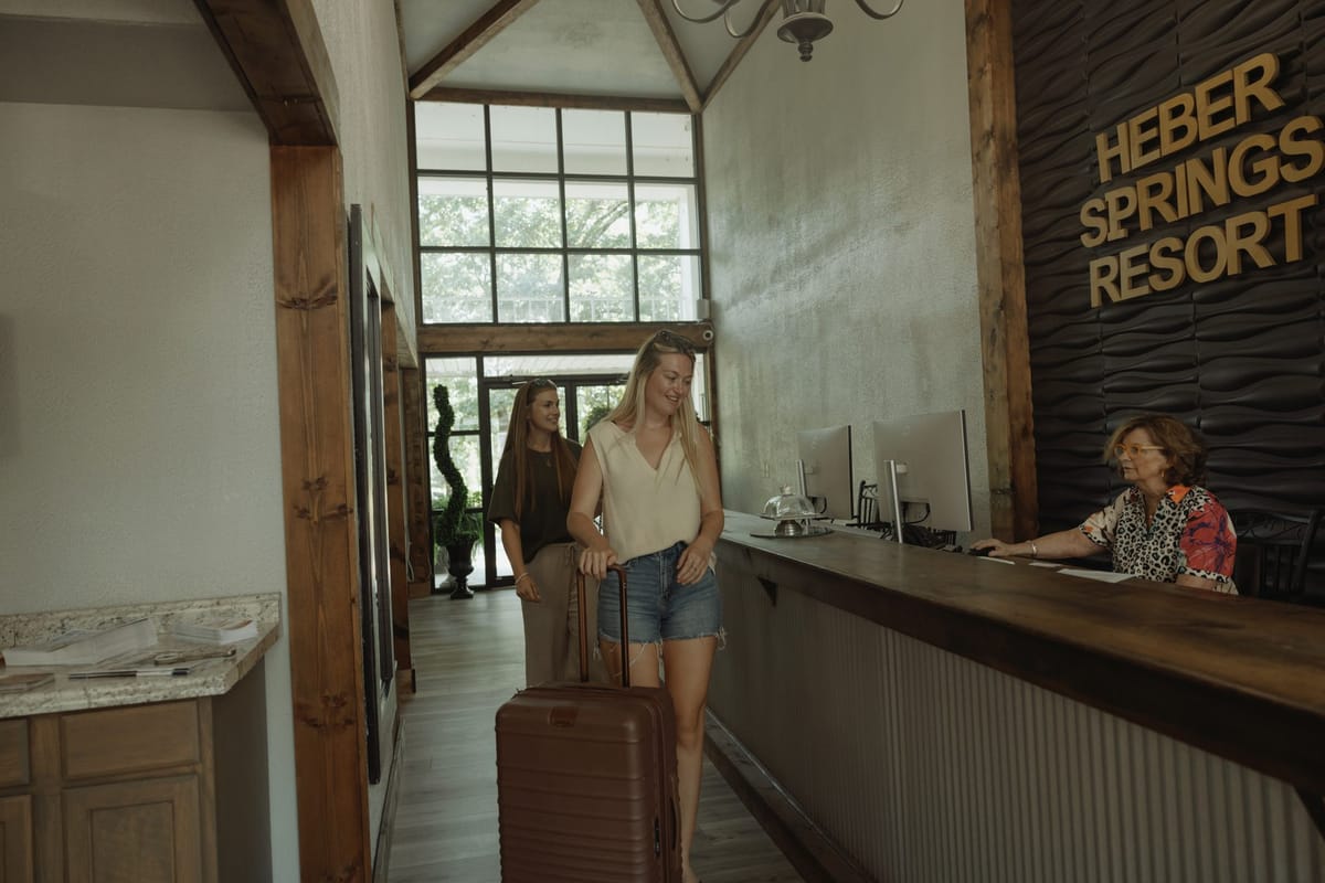 Guests checking in at the front desk