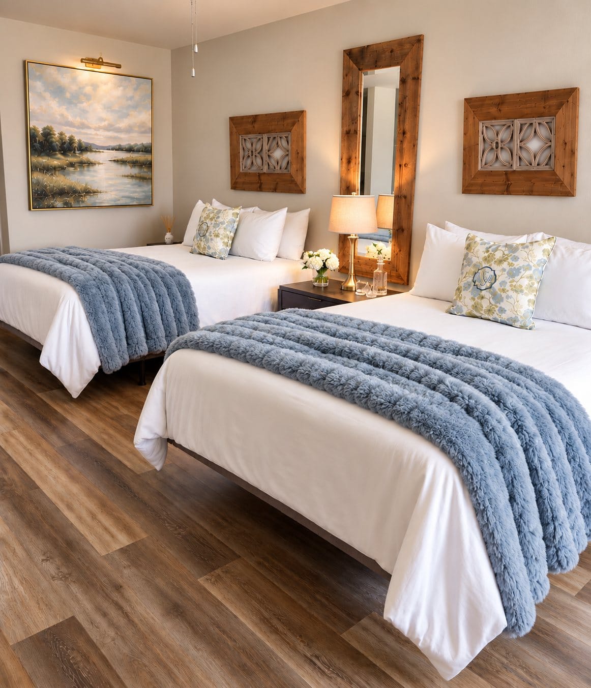 Queen room with two beds and blue throws