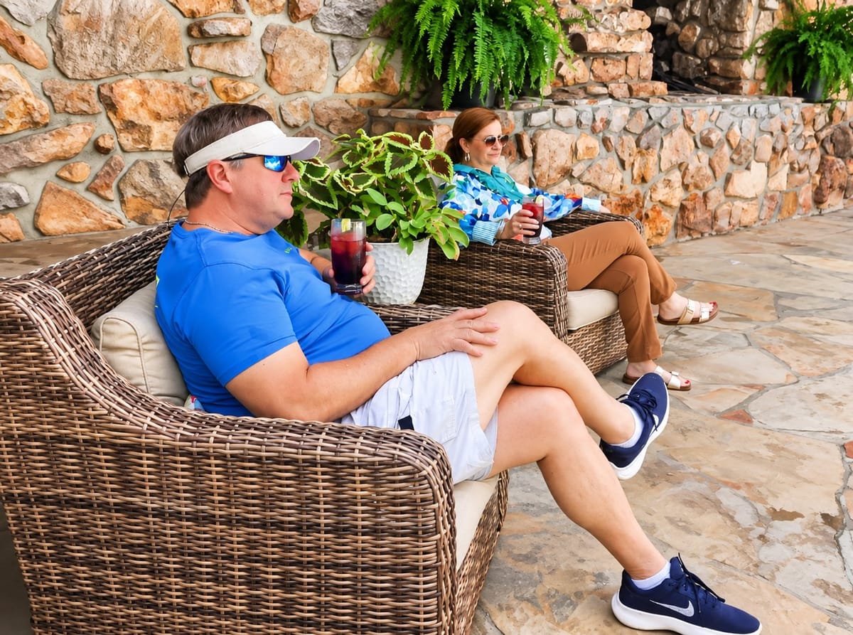 Guests relaxing on wicker patio seating